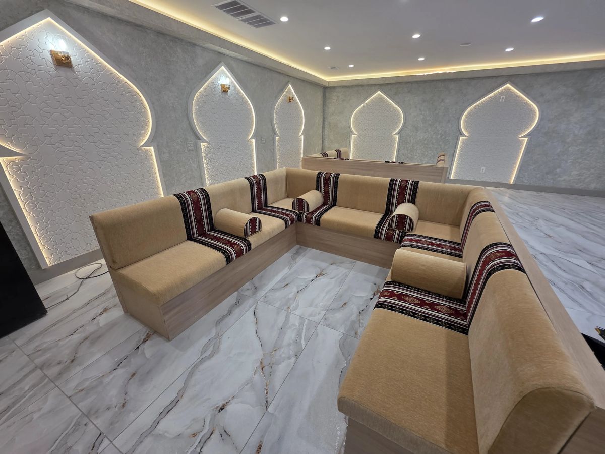 Majlis-style coffee shop seating with Arabic motifs